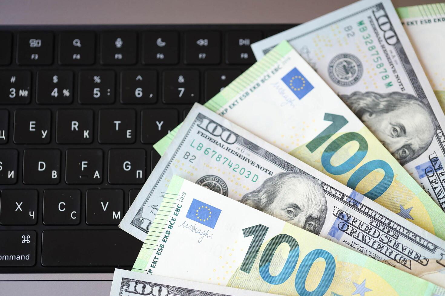 KYIV, UKRAINE - FEBRUARY 28, 2024 US Dollar and EU Euro money bills in fan layout. Different popular currencies photo
