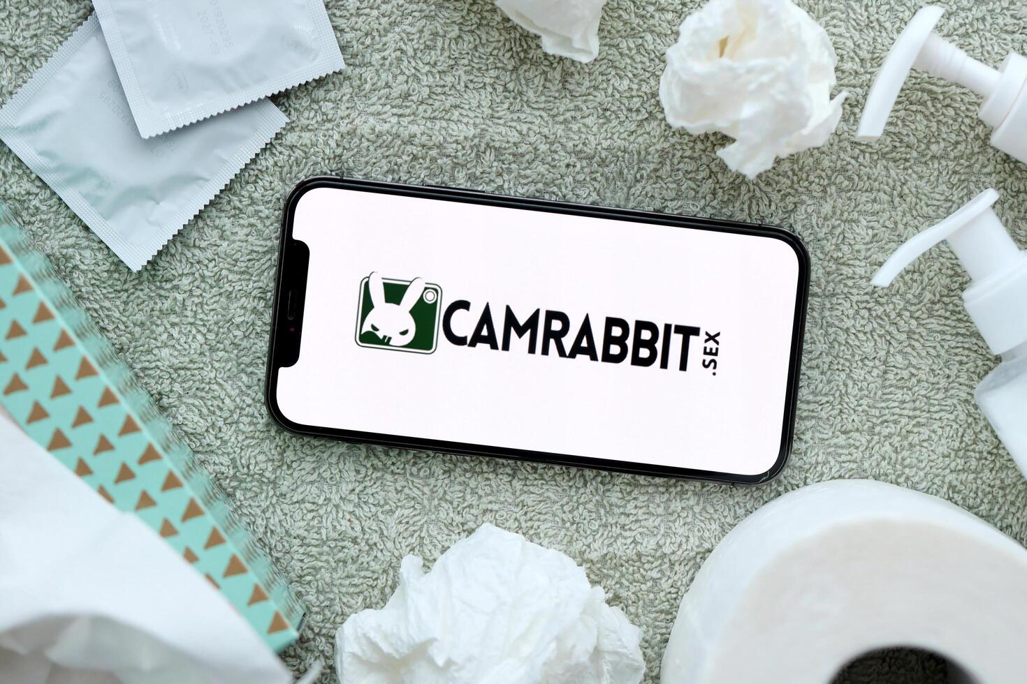 KYIV, UKRAINE - JANUARY 23, 2024 CamRabbit adult content website logo on display of iPhone 12 Pro photo