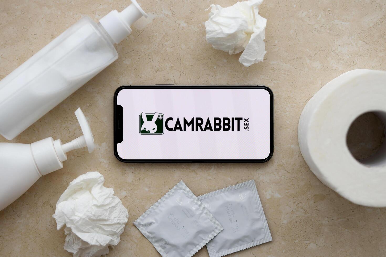 KYIV, UKRAINE - JANUARY 23, 2024 CamRabbit adult content website logo on display of iPhone 12 Pro photo