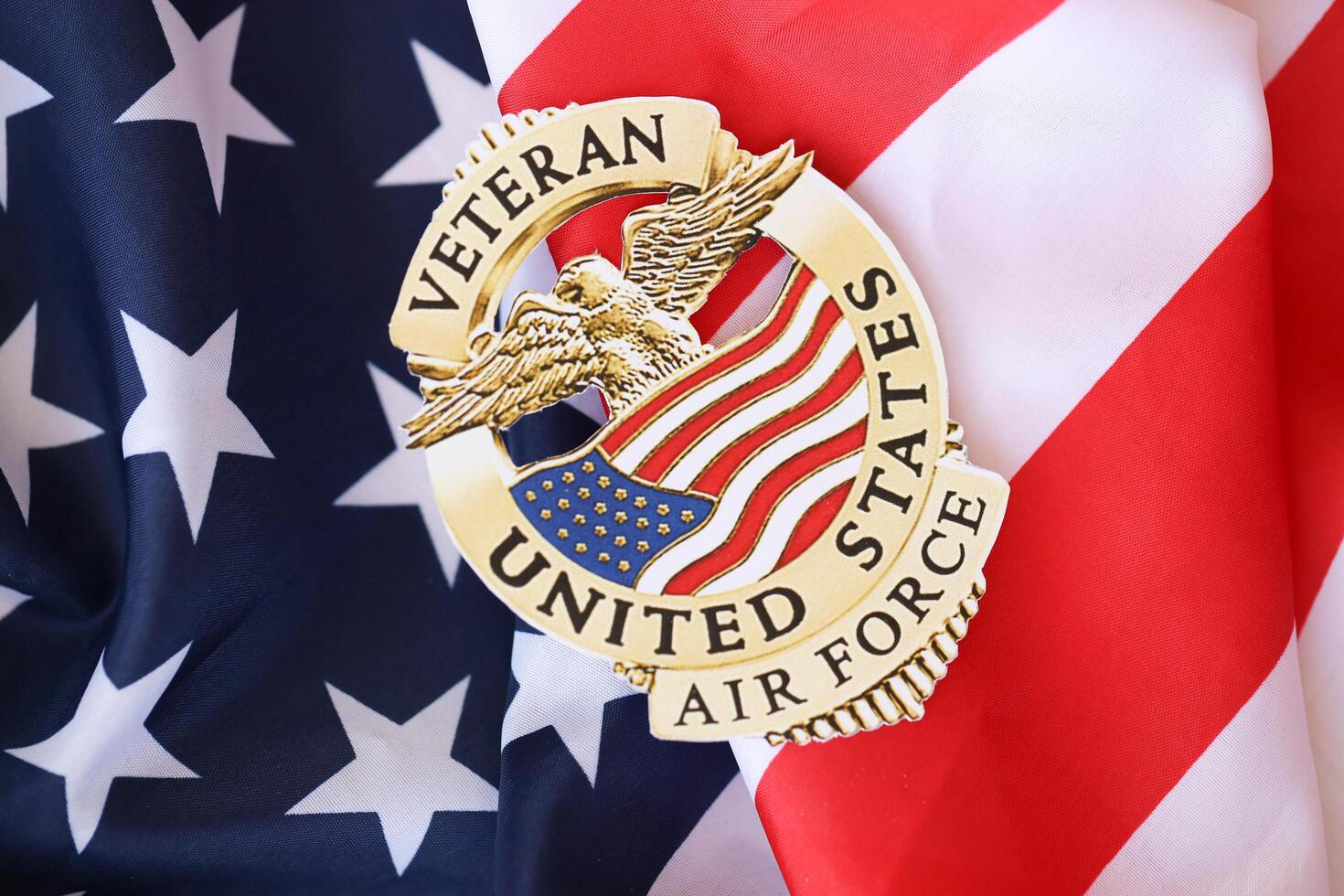KYIV, UKRAINE - MARCH 9, 2024 US Air Force Veteran badge on United States of America flag photo