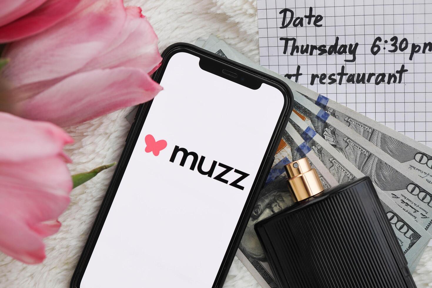 KYIV, UKRAINE - FEBRUARY 23, 2024 Muzz logo of famous dating website or app on iPhone display photo