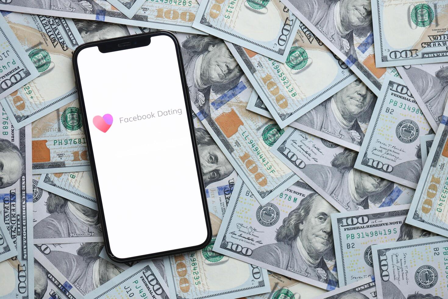 KYIV, UKRAINE - FEBRUARY 23, 2024 Facebook Dating logo of famous dating website or app on iPhone display photo