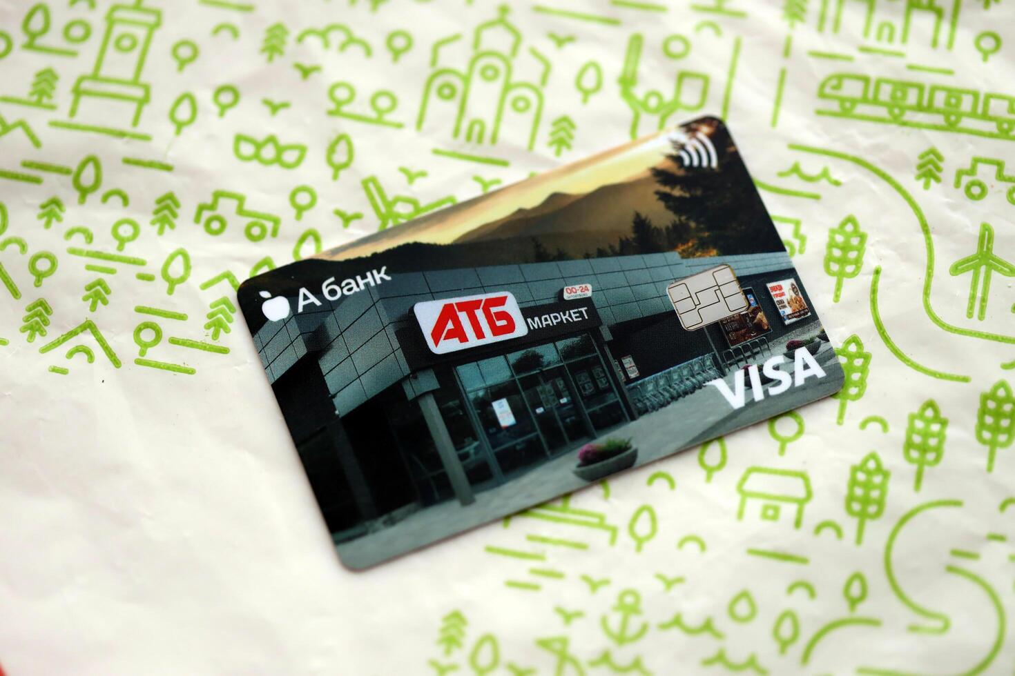 KYIV, UKRAINE - 4 MAY, 2023 ATB supermarket discount VISA card for low prices on different goods and products photo