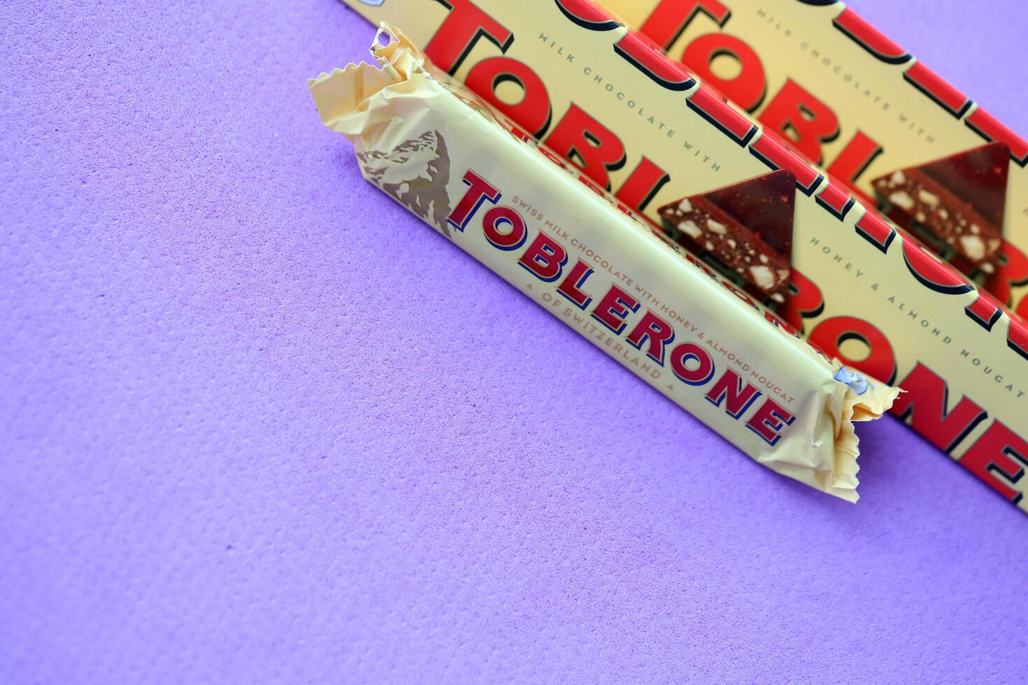 KYIV, UKRAINE - OCTOBER 31, 2023 Yellow Toblerone Chocolate Bar. Toblerone originated in Switzerland around 1908 photo