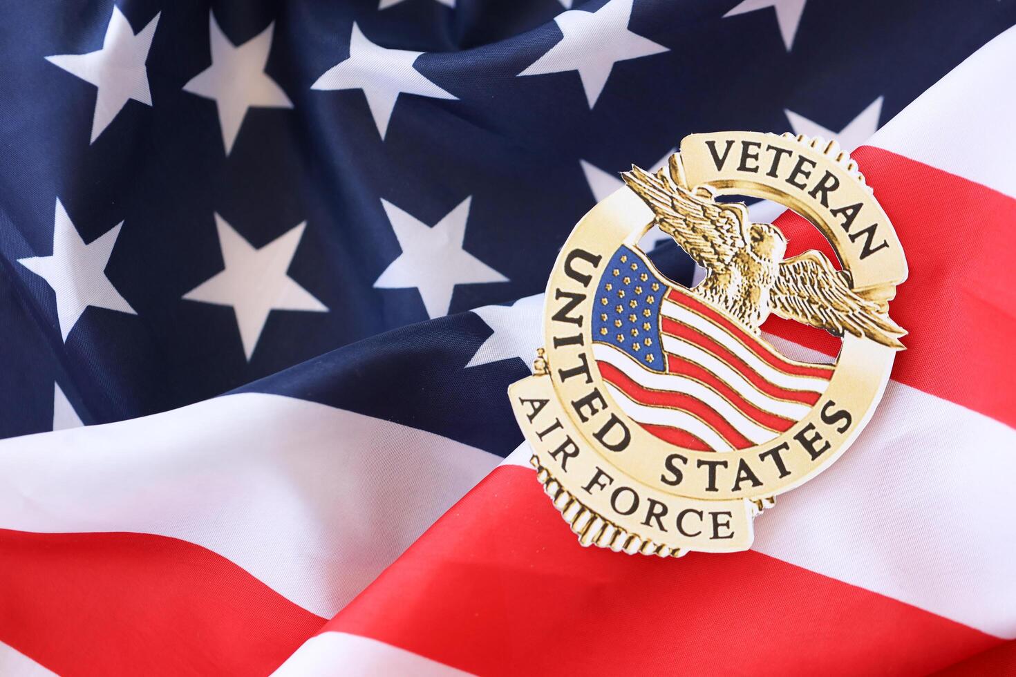 KYIV, UKRAINE - MARCH 9, 2024 US Air Force Veteran badge on United States of America flag photo
