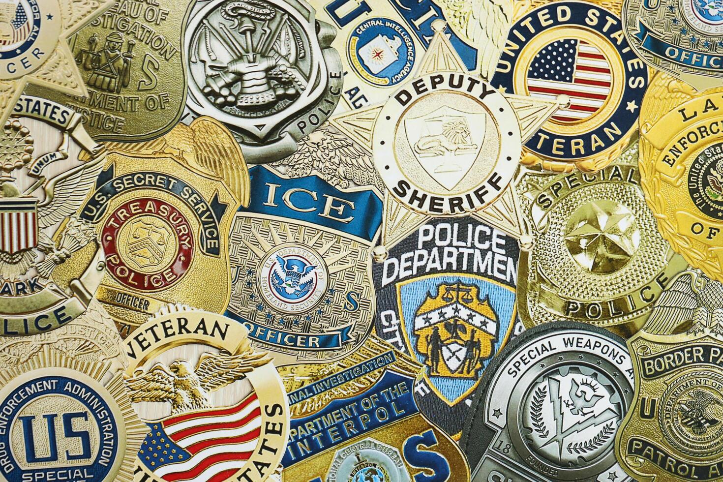 KYIV, UKRAINE - MARCH 9, 2024 Badges of different United States police departments printed on paper photo