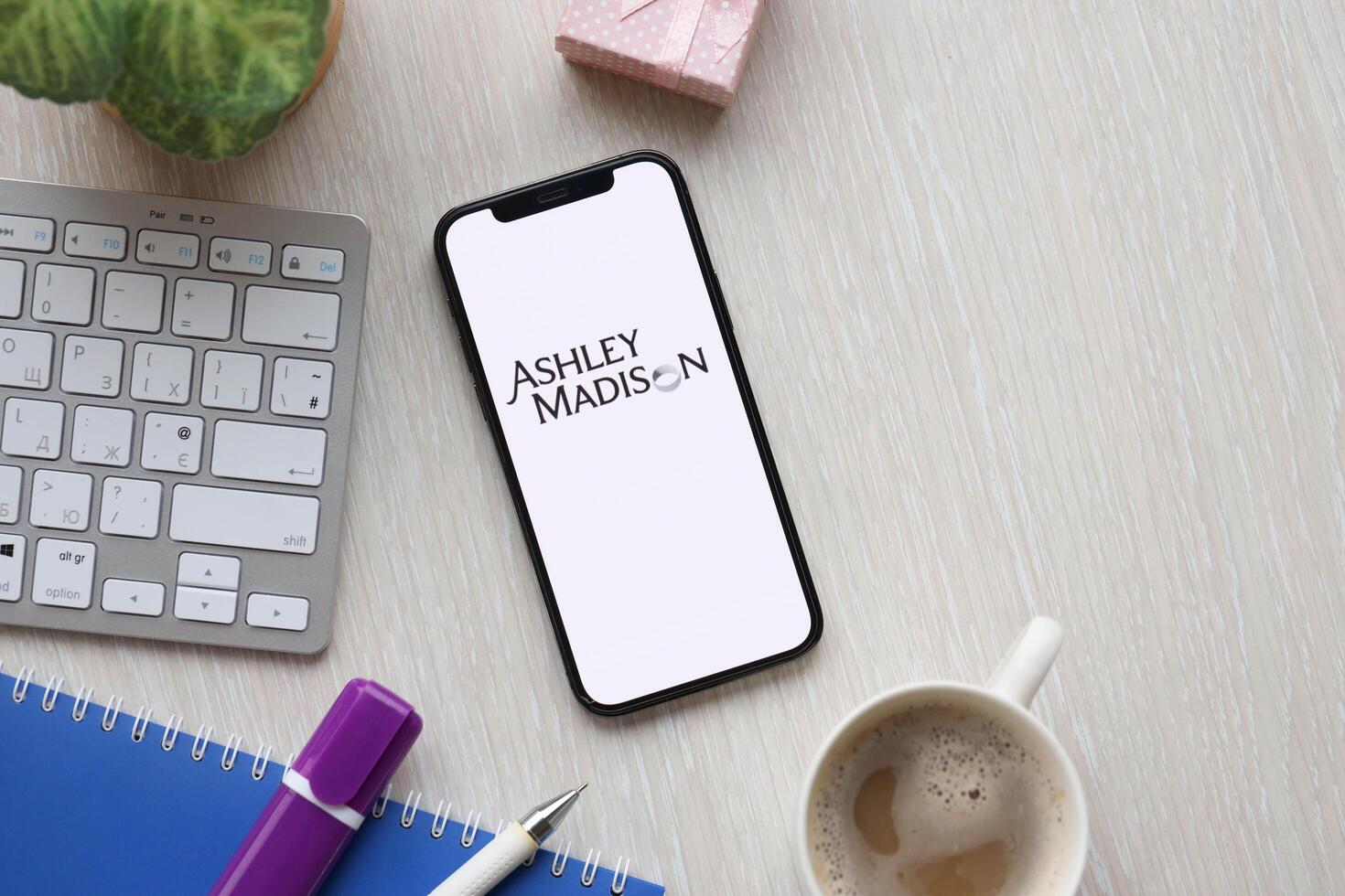 KYIV, UKRAINE - FEBRUARY 23, 2024 Ashley Madison logo of famous dating website or app on iPhone display photo