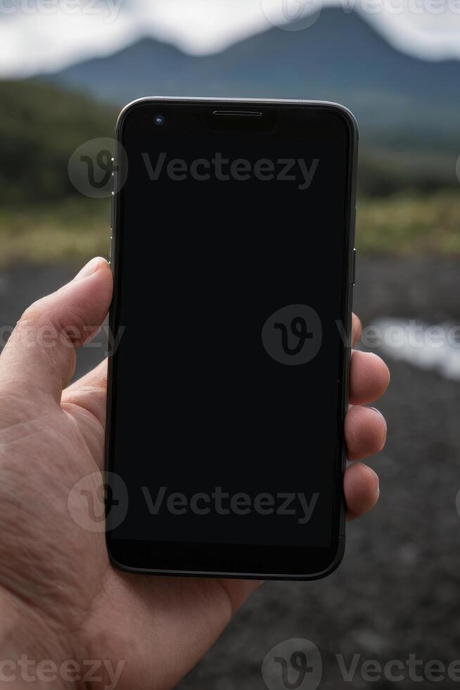Close-up of a person's hand holding a smartphone photo
