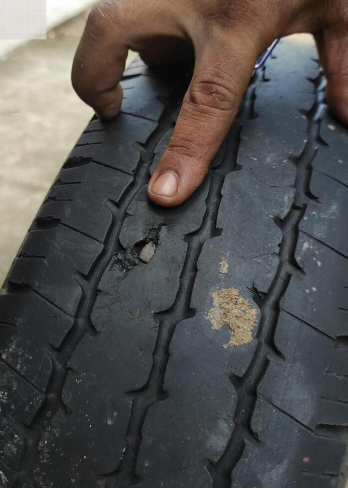 a broken car tire in the workshop photo
