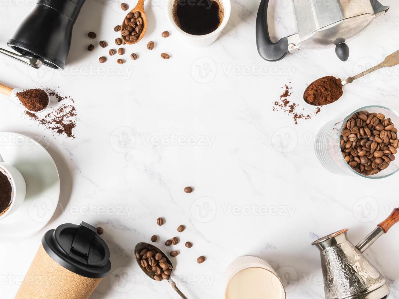 Flat lay frame of coffee, various utensils for making coffee and cups of coffee photo