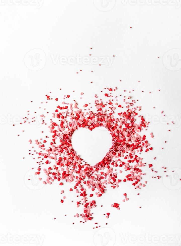 Red and pink sugar sprinkles dots and hearts photo