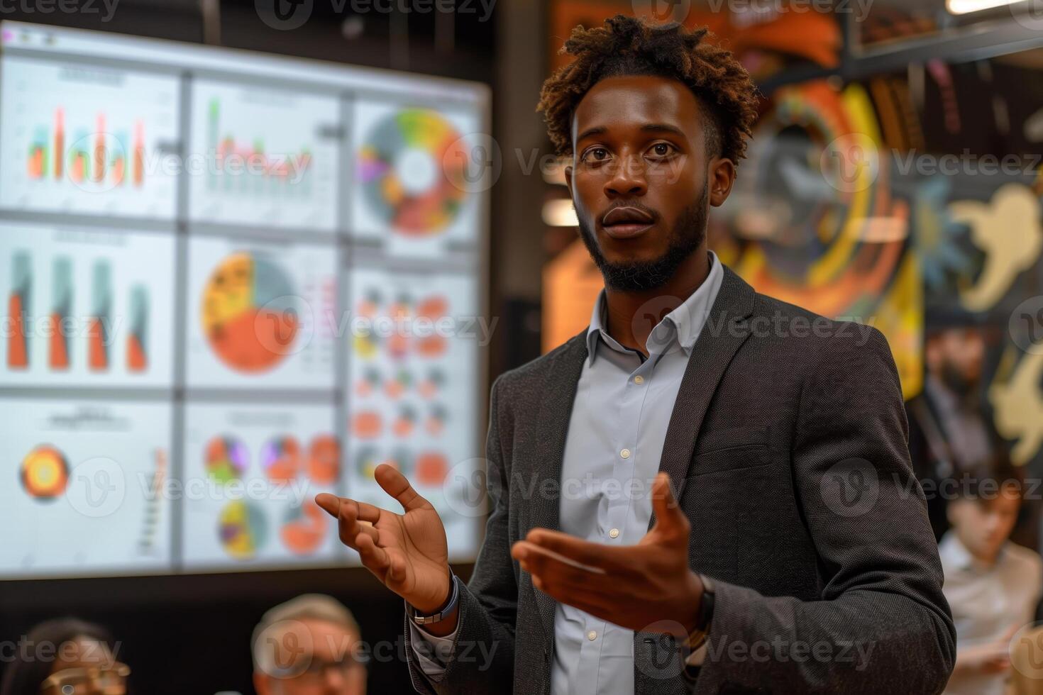 Businessman giving presentation with data visualizations on screen photo