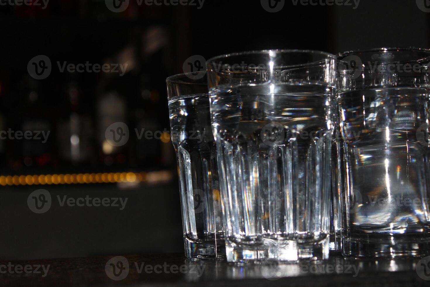Empty glasses on the counter in bar, club. photo