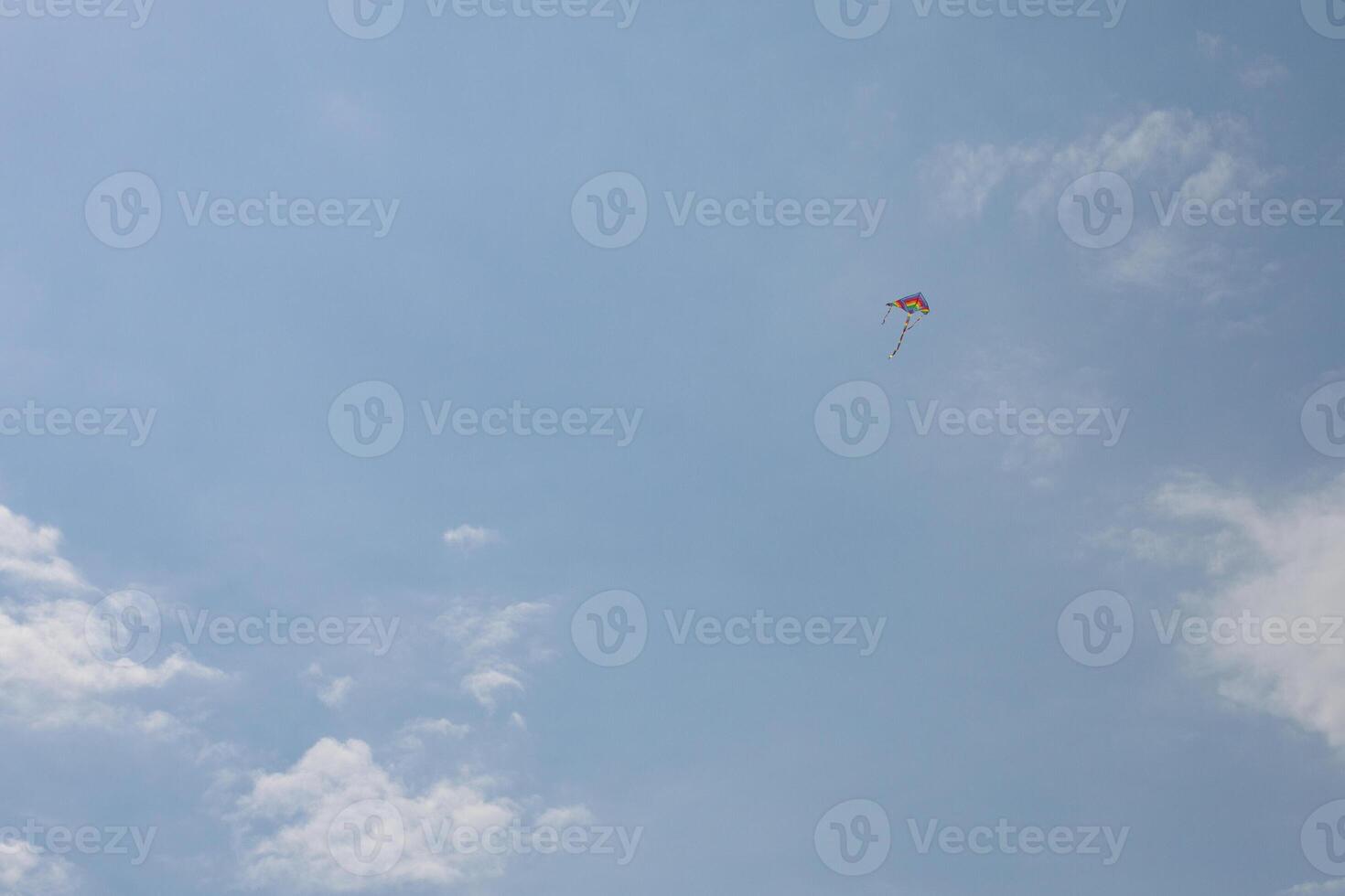 Colorful Kite Flying in Clear Sky photo