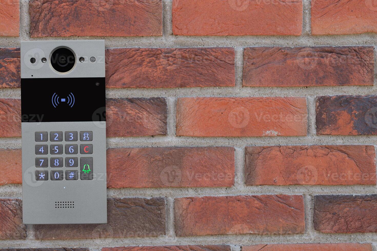 Doorbell Intercom on Brick Wall photo