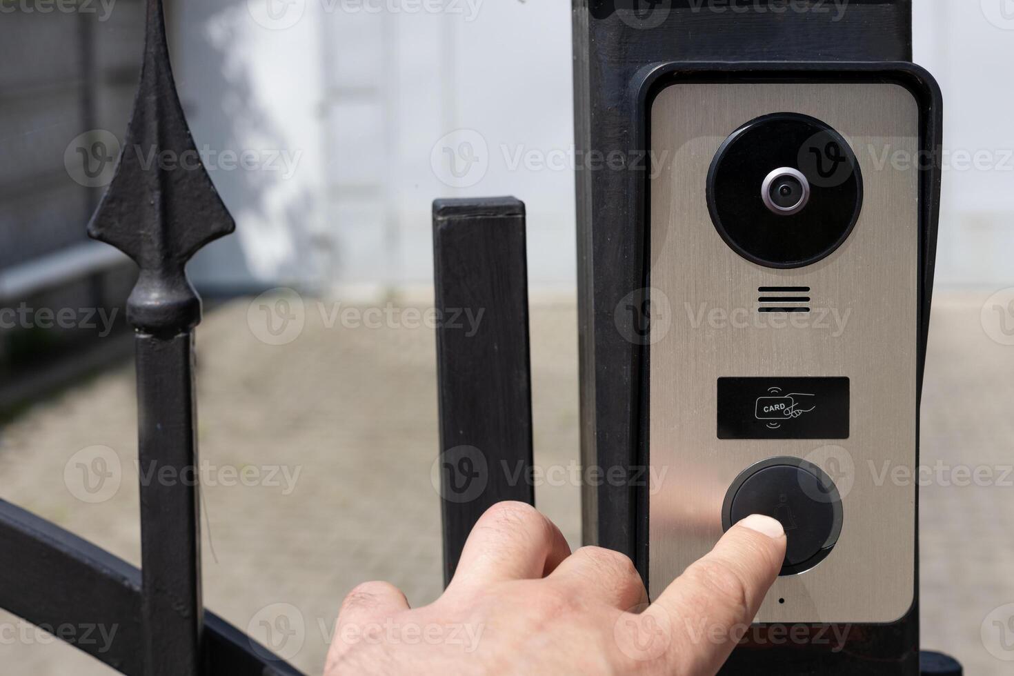 Modern Fingerprint Doorbell on Iron Gate photo