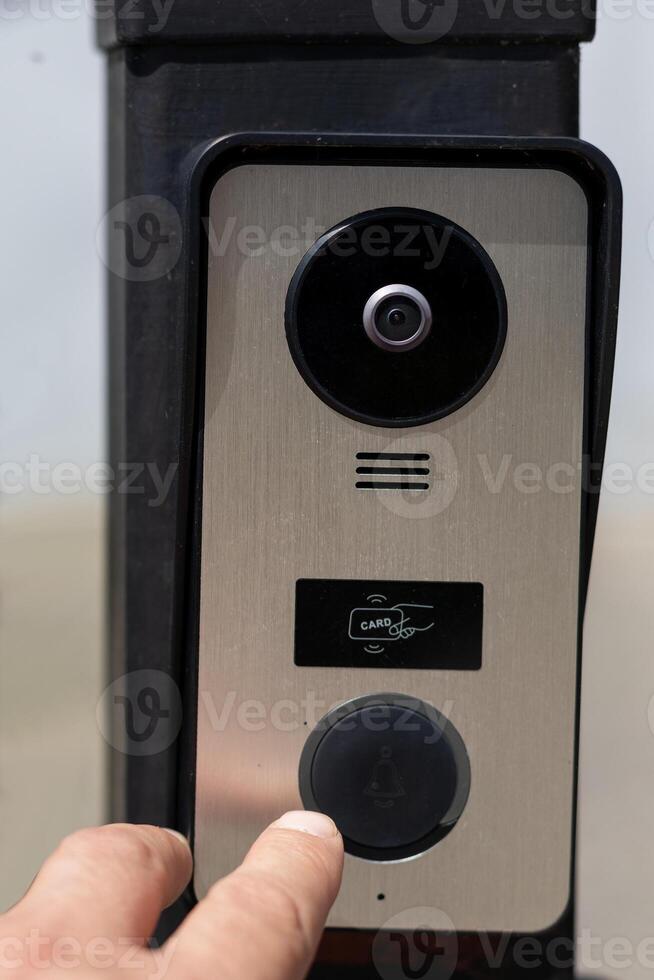 Fingerprint Doorbell Close-Up on Iron Gate photo