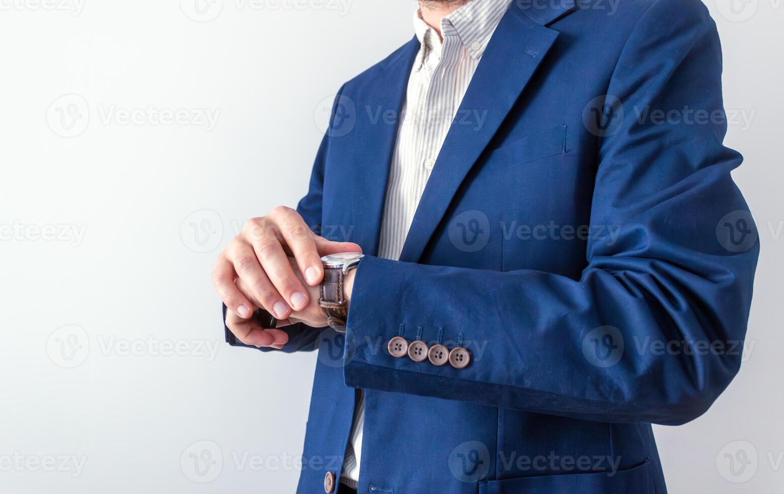 businessman looking at classic wristwatch,diary page background, time management concept photo