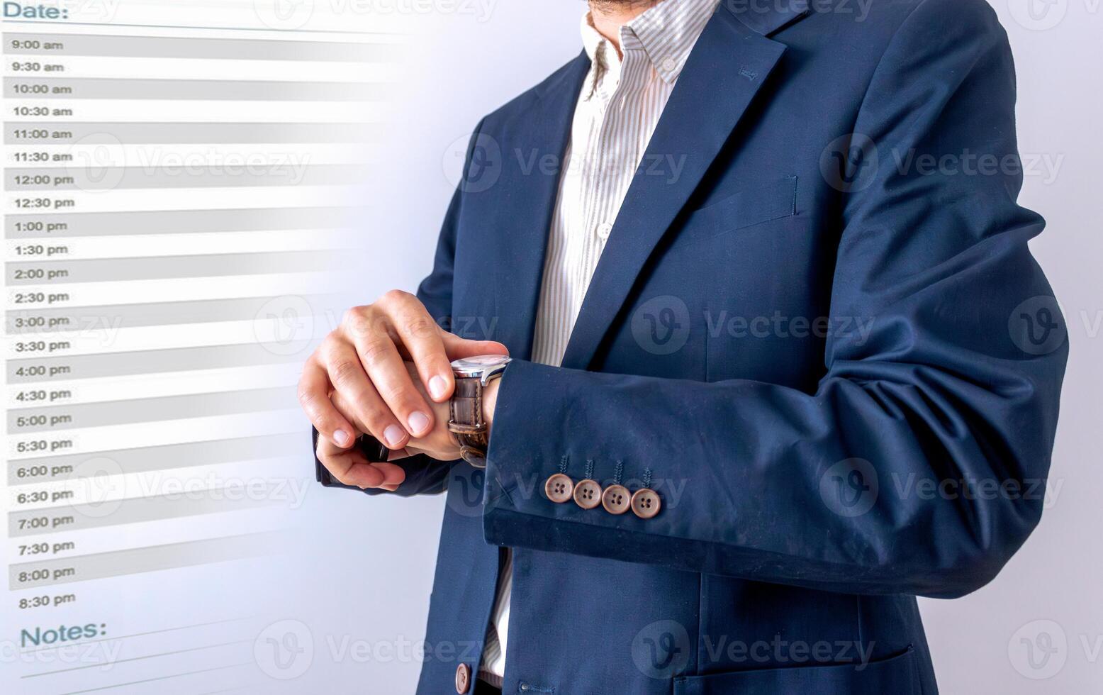businessman looking at classic wristwatch,diary page background, time management concept photo