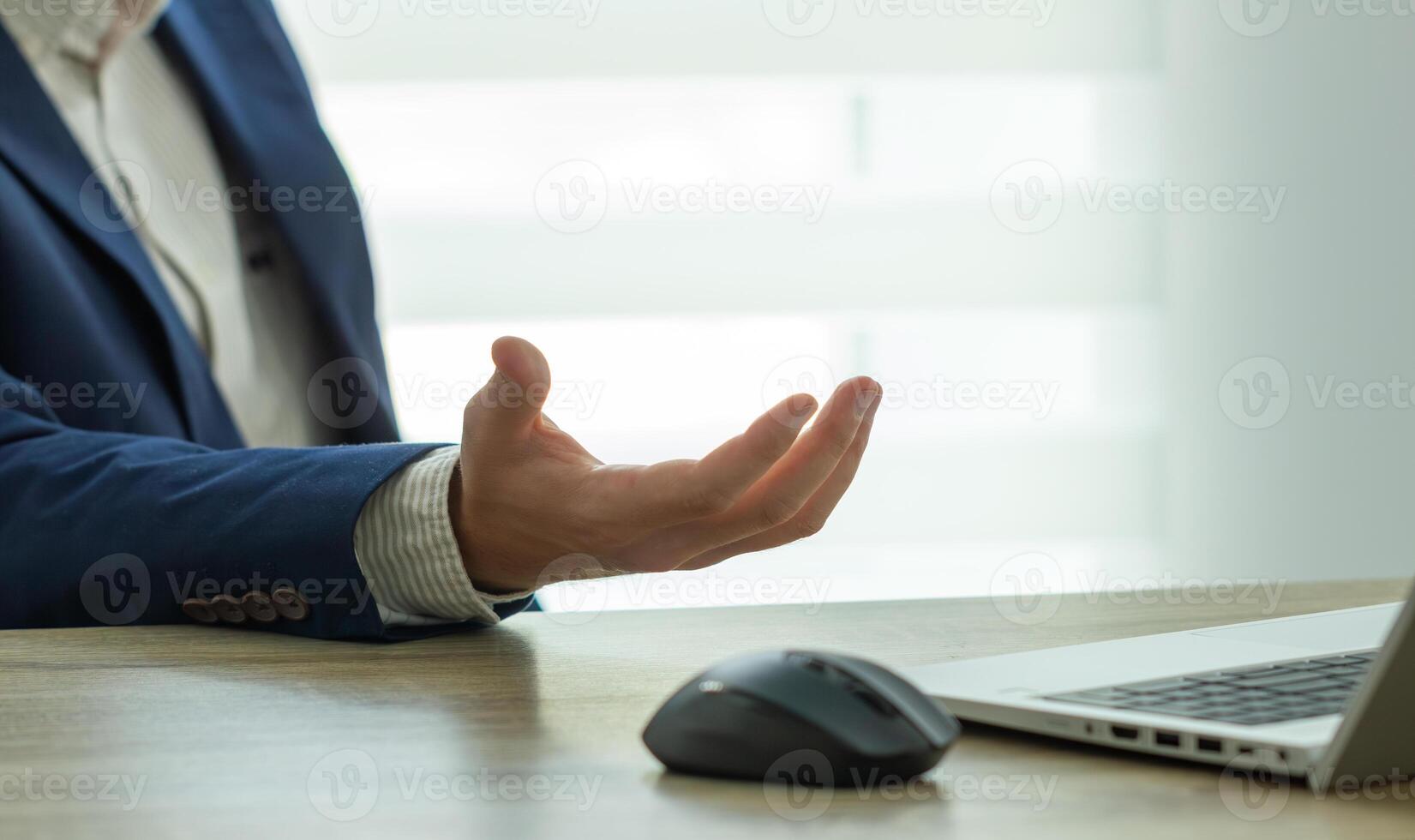 business in suit man gesticulates, negotiation concept photo
