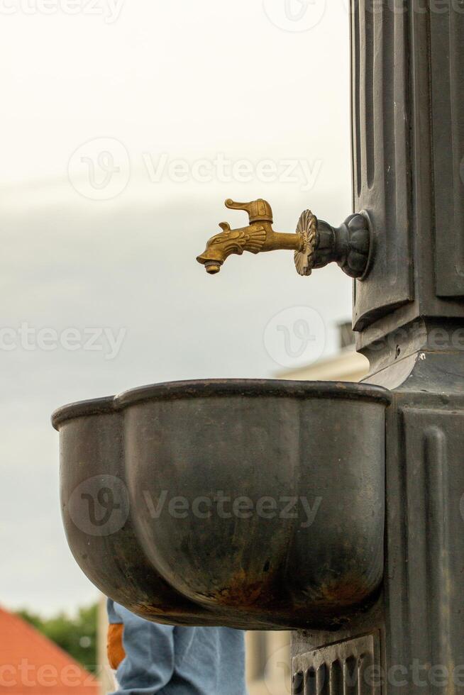 free public drinking water tap, extreme high temperature in the world, coolness, water balance in the body photo