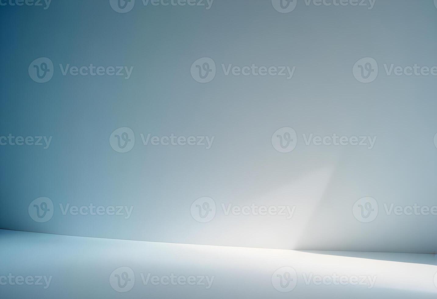 an empty room with a white wall and a light photo