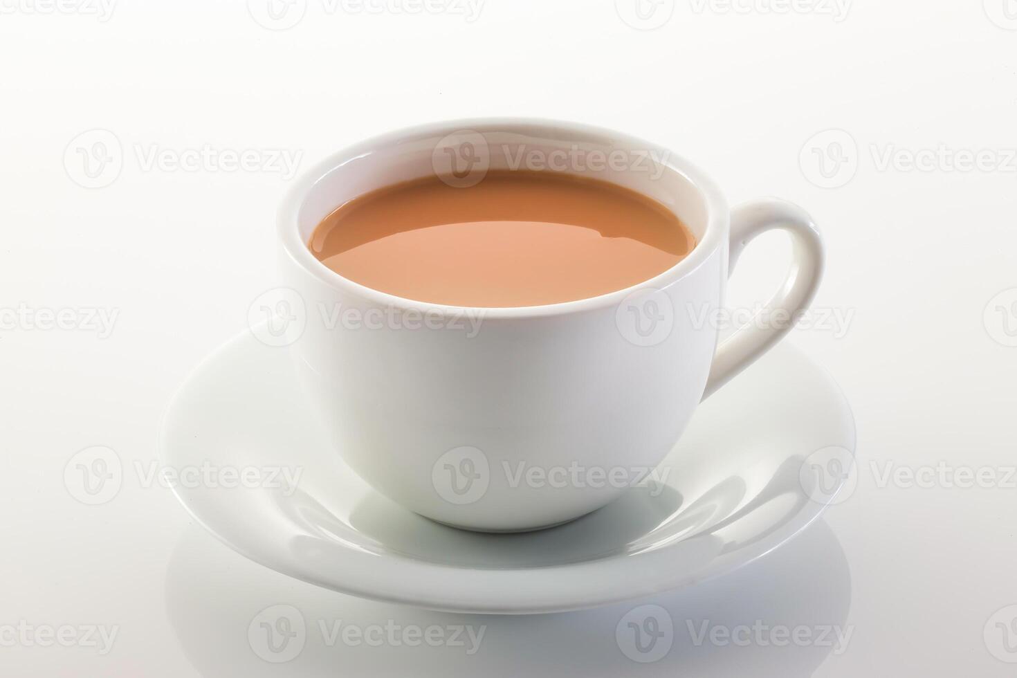 Hot milk tea ir chai served in cup isolated on grey background side view of chinese hot drink photo