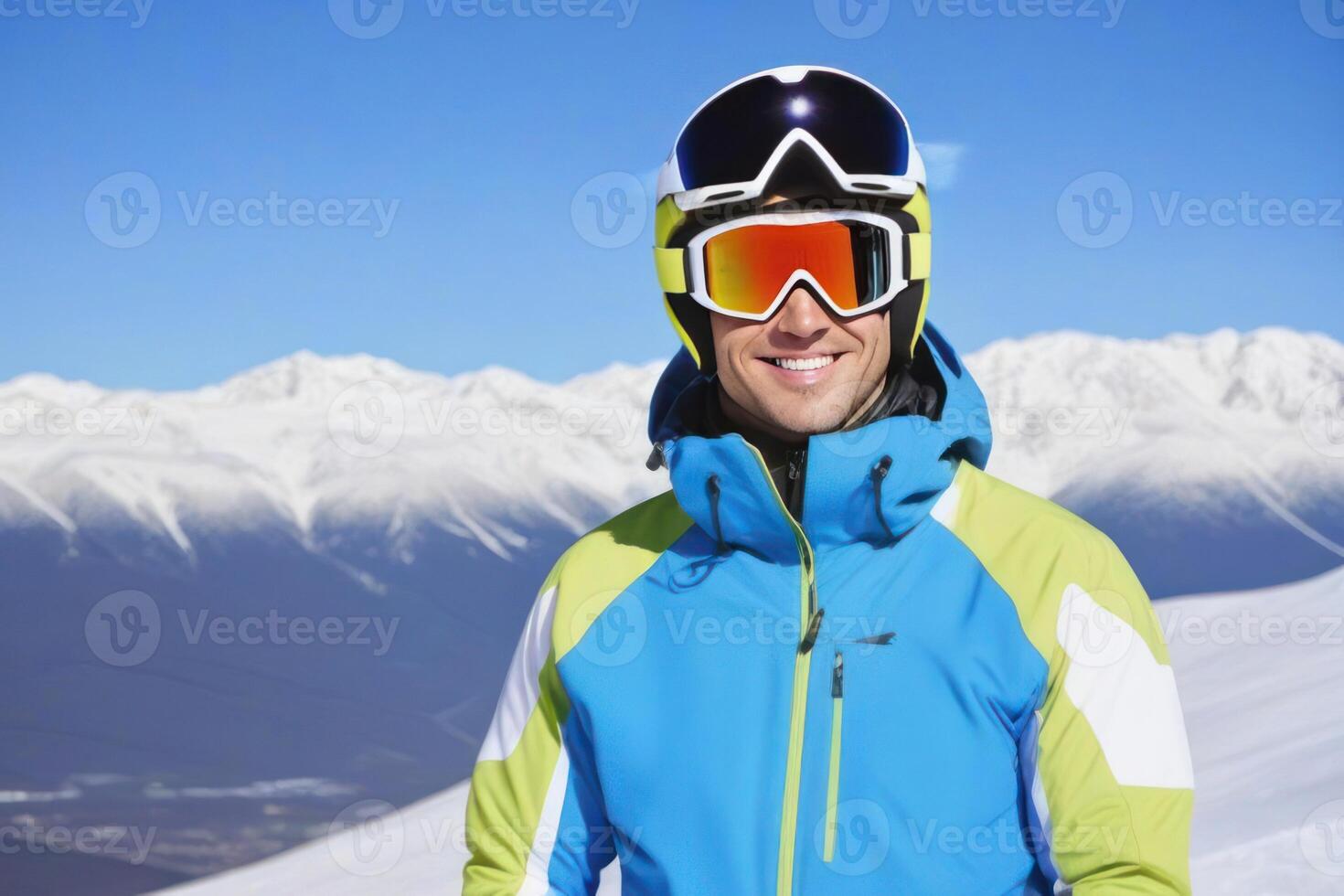 Portrait of a male skier on the mountain in sunny day. photo