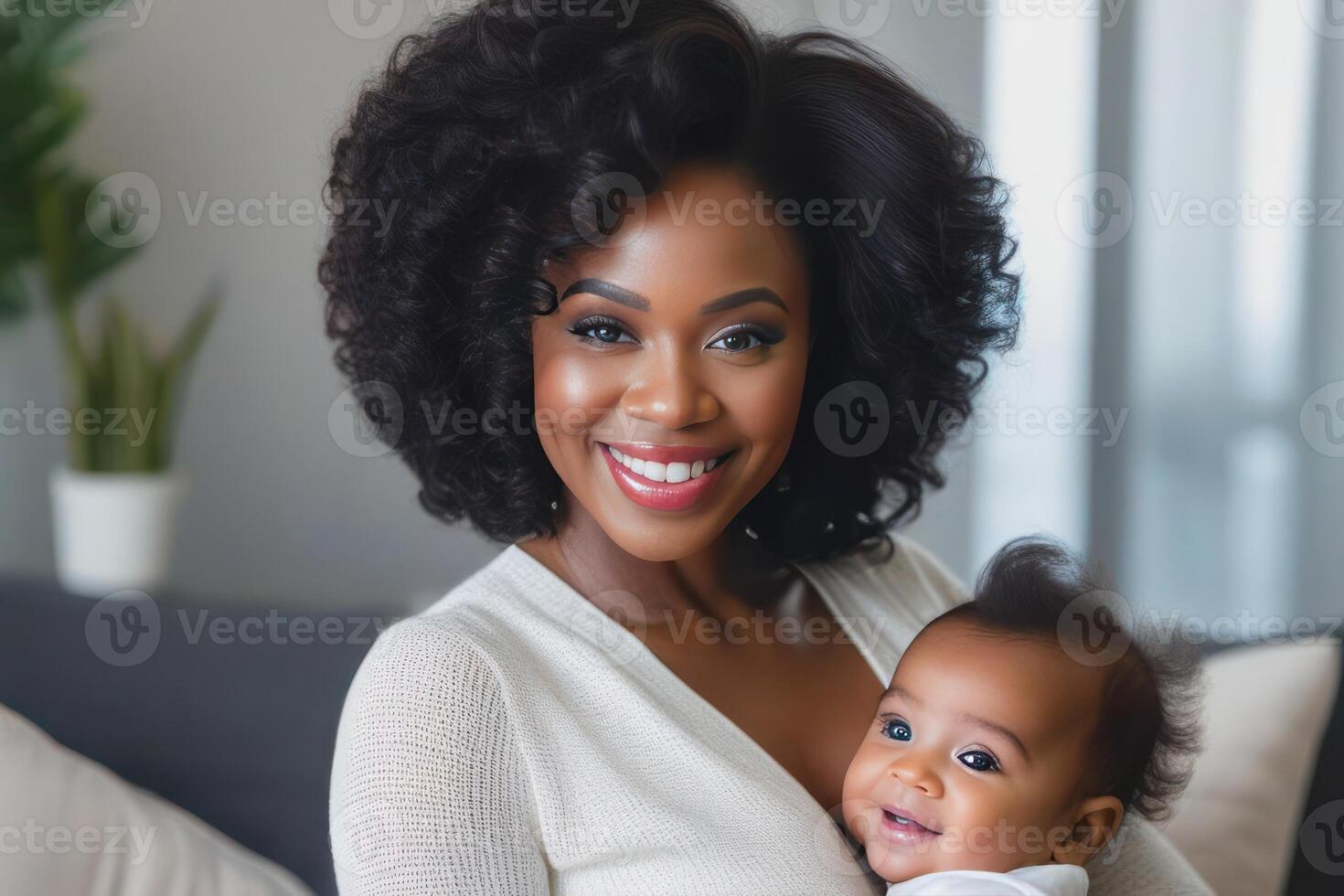Beautiful young smiling black skin mom hugs happy baby. Concept of family love and happiness. photo