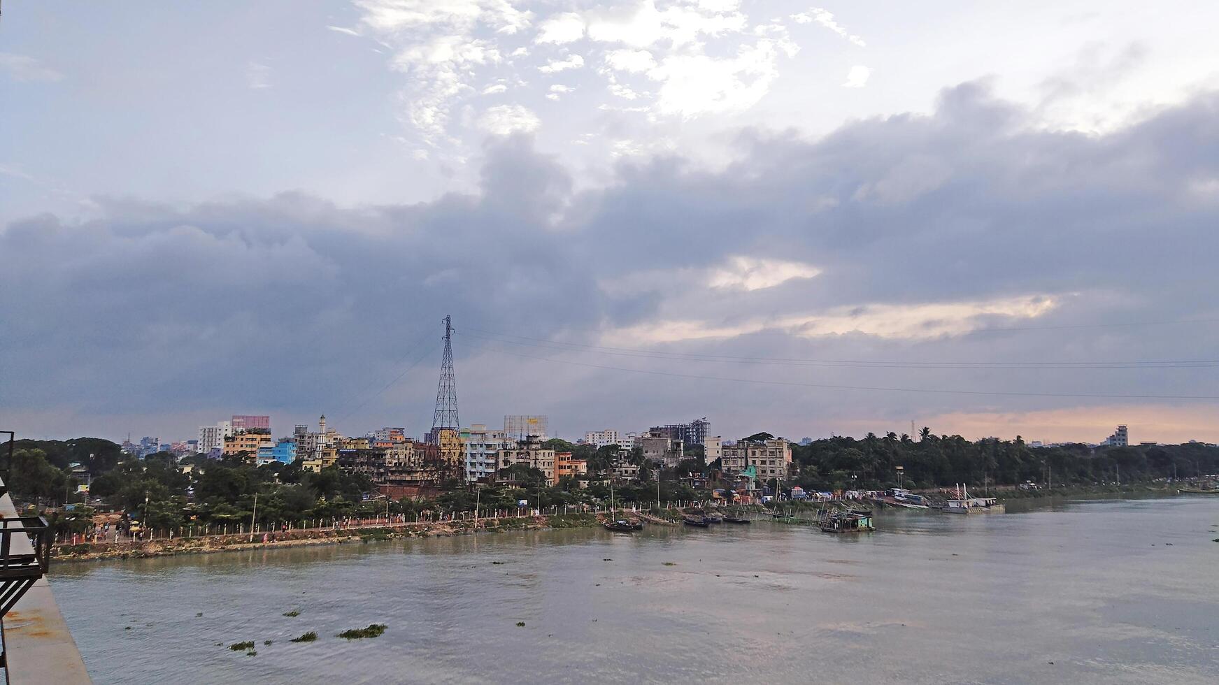 Beautiful scenery of colorful clouds reflecting in the river during sunset photo