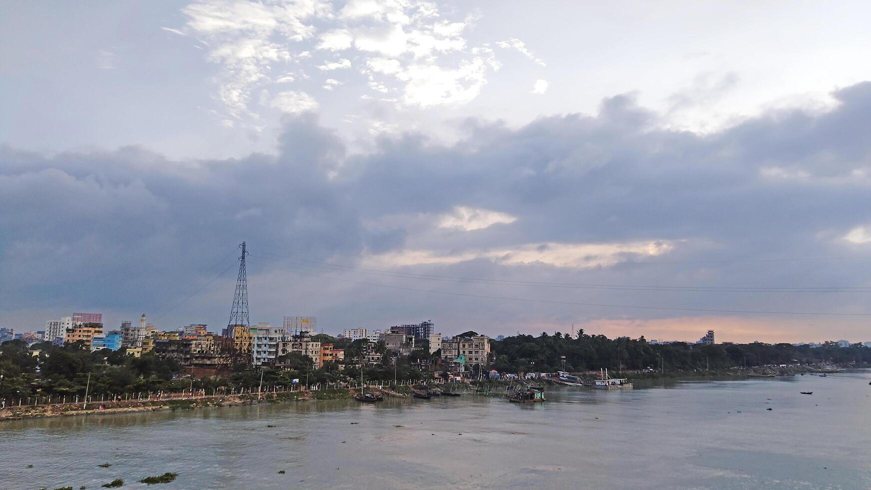 Beautiful scenery of colorful clouds reflecting in the river during sunset photo