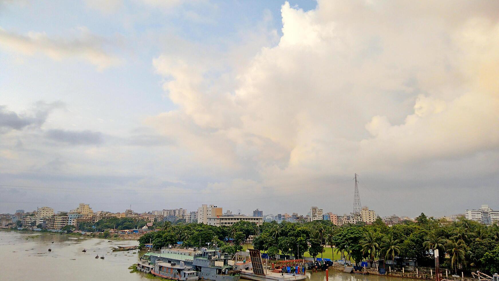 Beautiful scenery of colorful clouds reflecting in the river during sunset photo