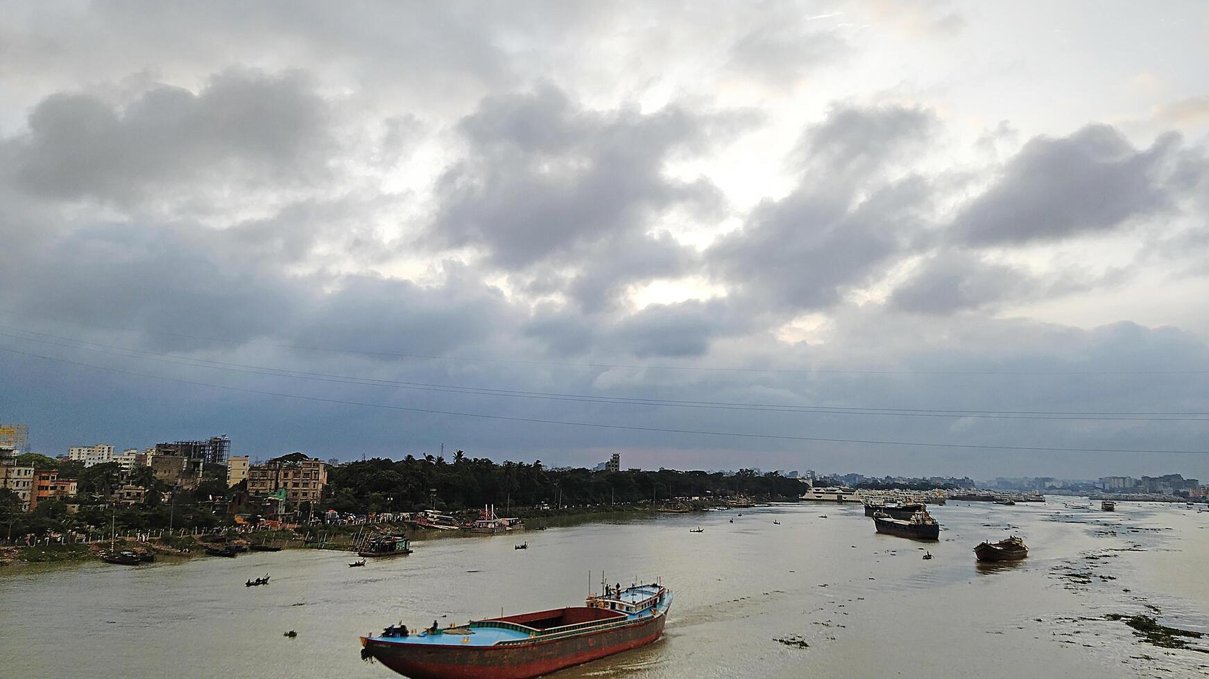 Beautiful scenery of colorful clouds reflecting in the river during sunset photo