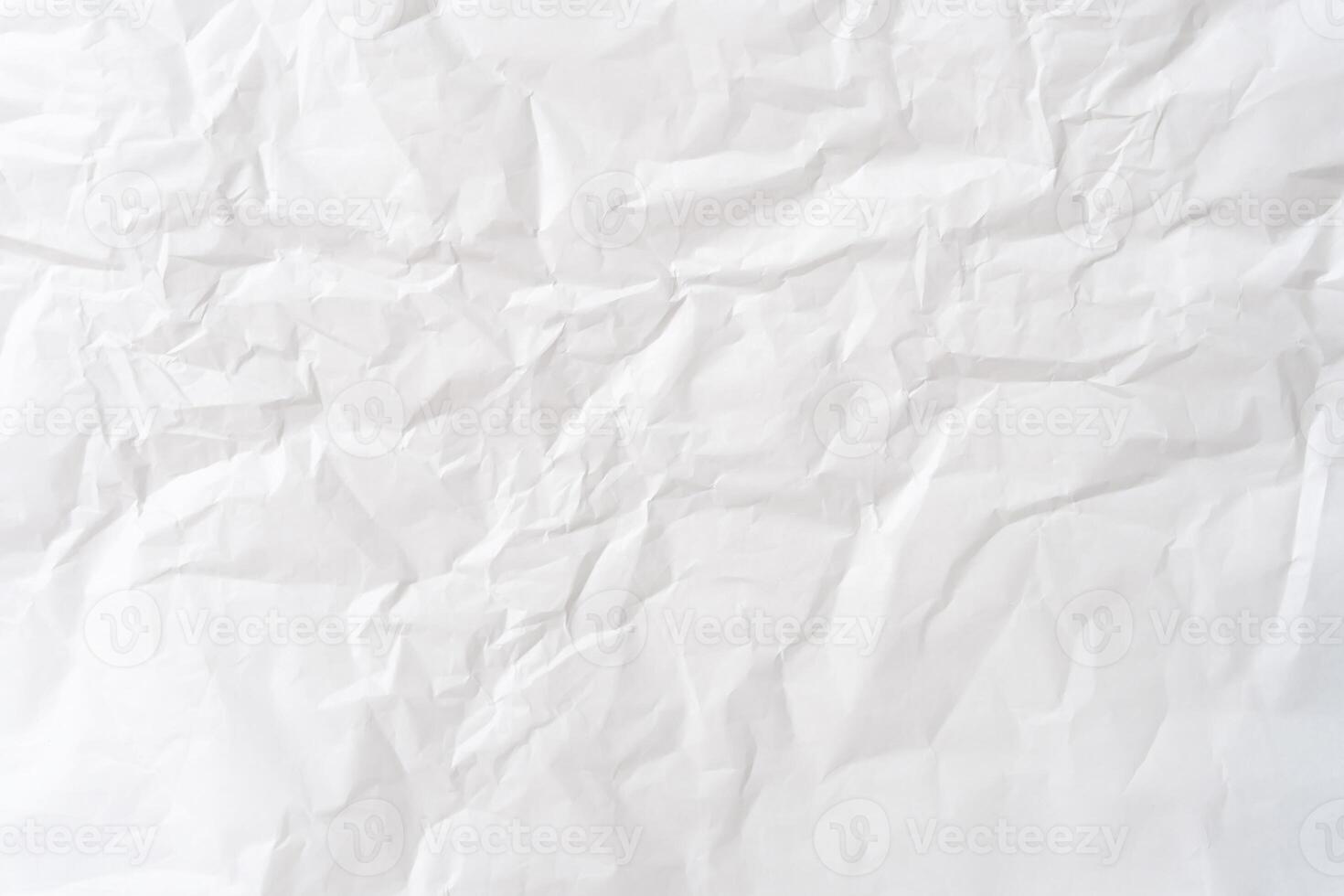 Top view of white wrinkled or crumpled paper texture used as white wrinkled paper background texture photo