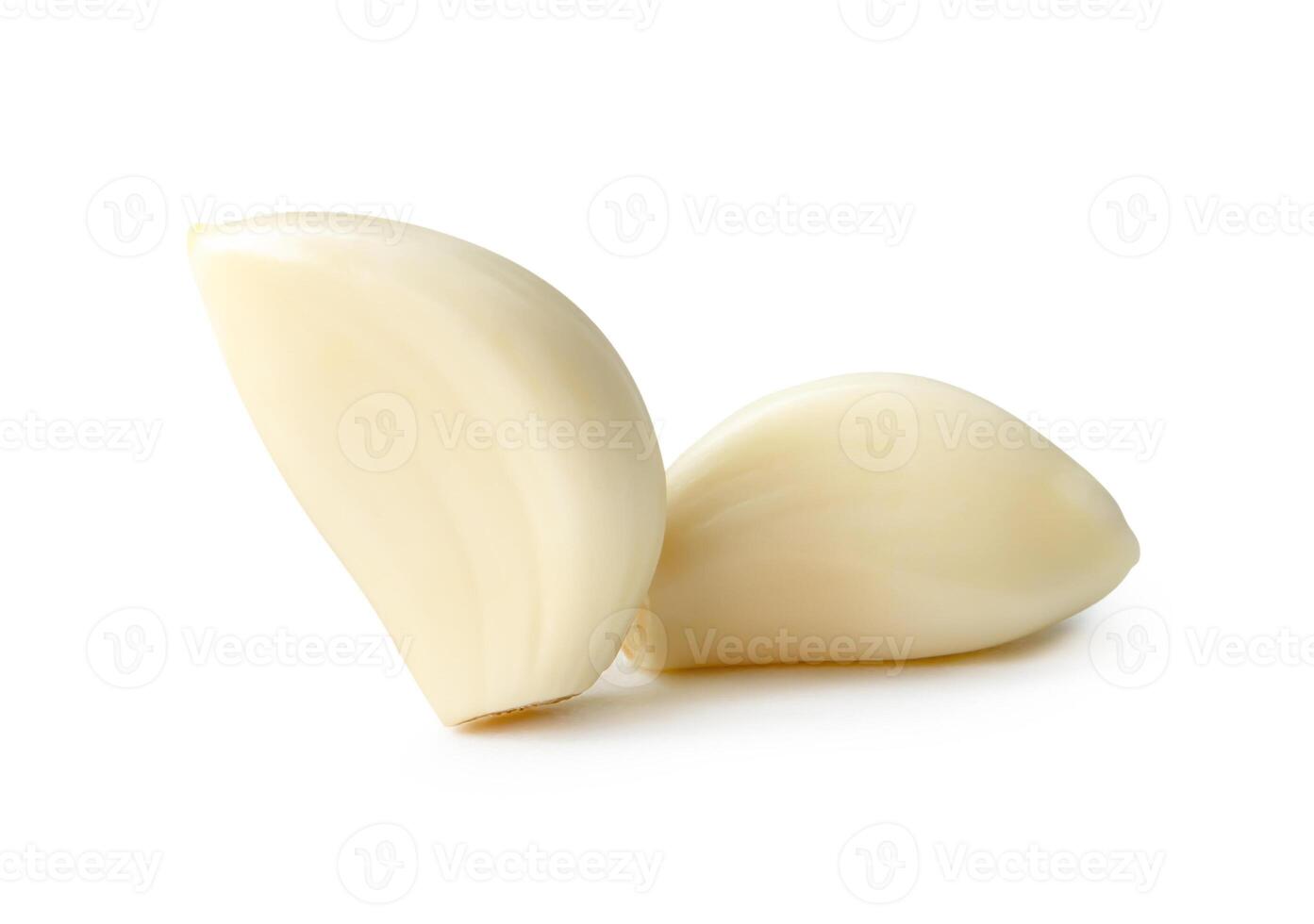 Front view of peeled garlic cloves in stack isolated on white background with clipping path photo