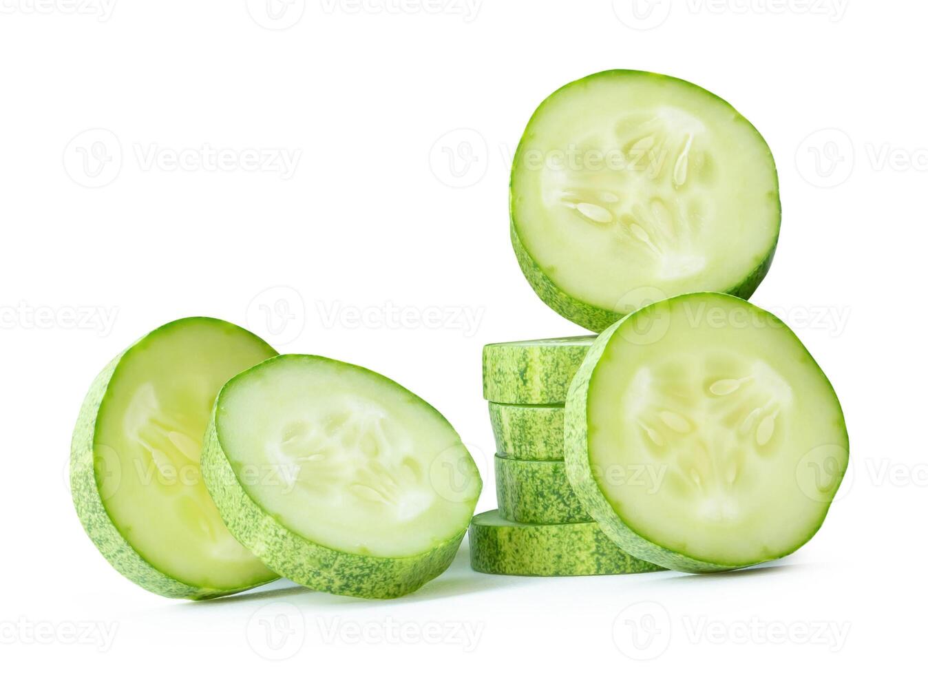 Front view of green cucumber slices or pieces in stack isolated on white background with clipping path photo