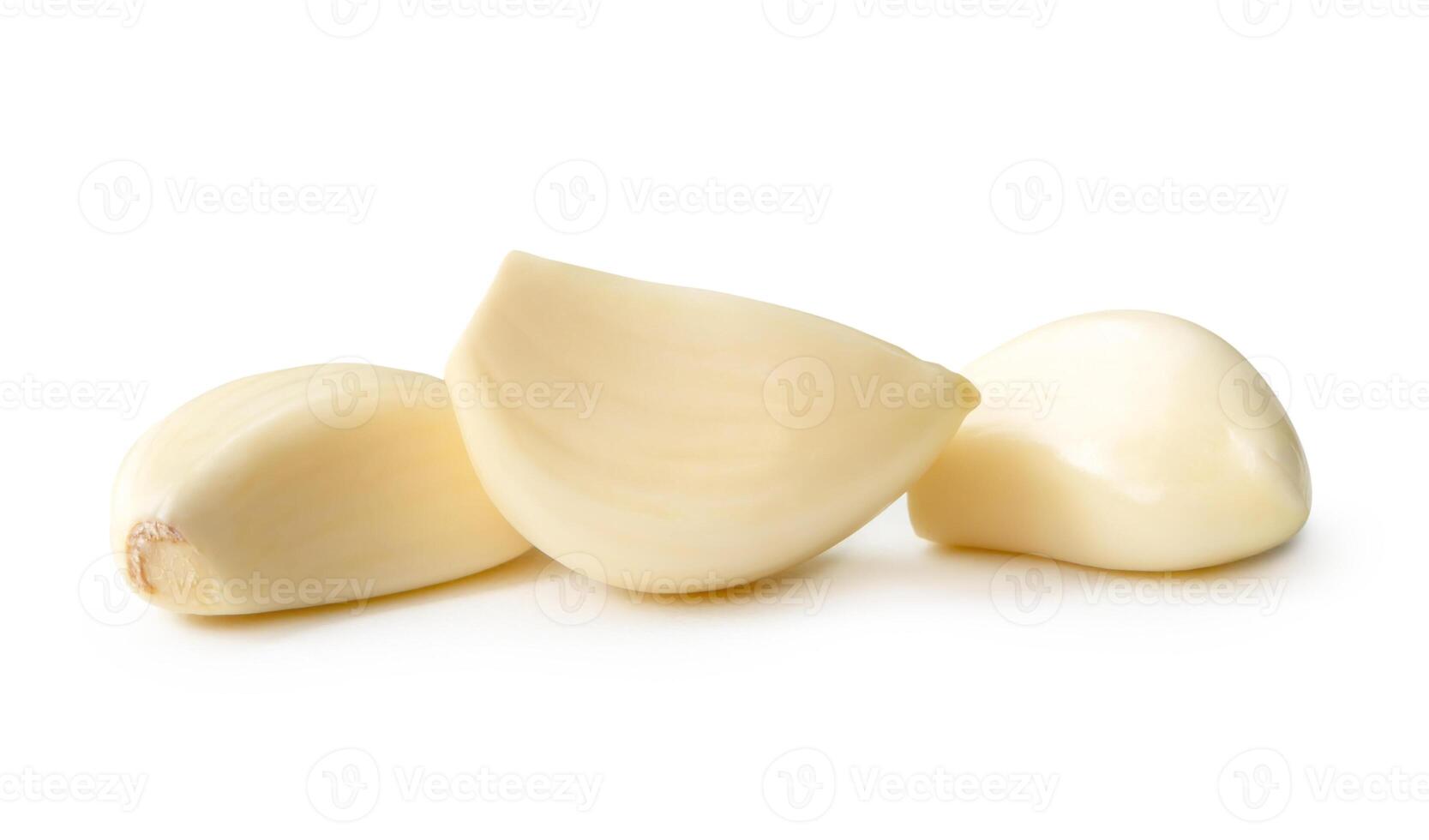 Front view of white peeled garlic cloves isolated on white background with clipping path. photo