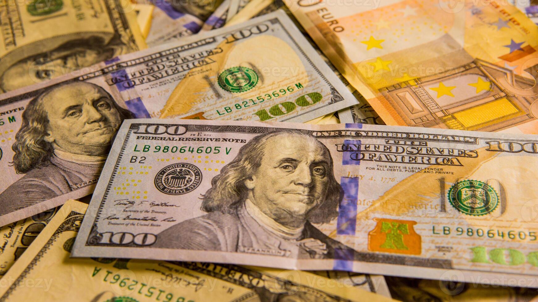 Background with money. US Dollar. American hundred-dollar bills. Euro banknote. One hundred dollars. Business concept photo