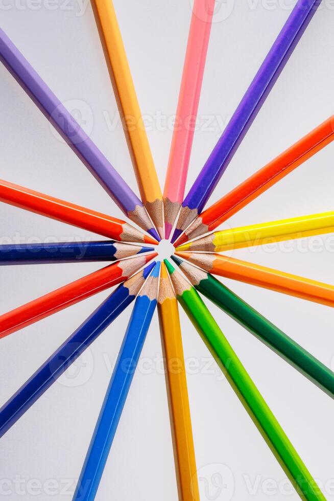 Color pencils on white background. Free space for text. Tools for drawing, education, school, creativity. photo