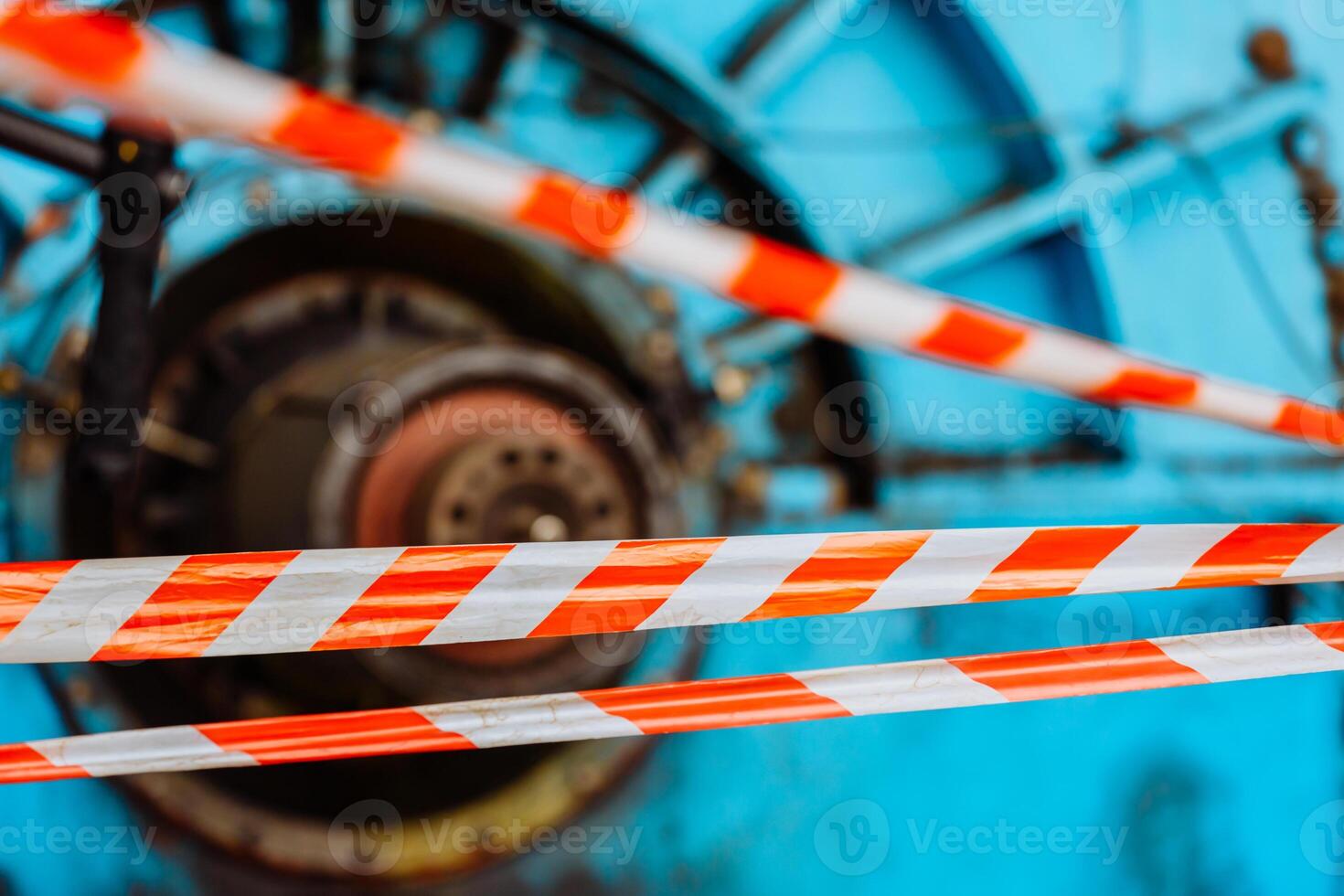 Steam turbine during the repair. Equipment, pipes at the power plant. Fencing with an alarm tape. Zone of increased danger. photo