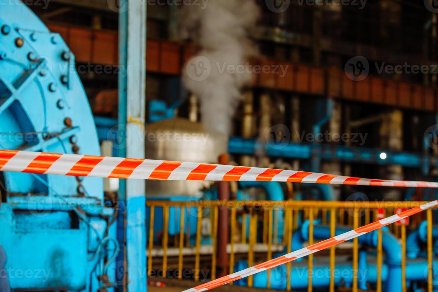 Steam turbine during the repair. Equipment, pipes at the power plant. Fencing with an alarm tape. Zone of increased danger. photo