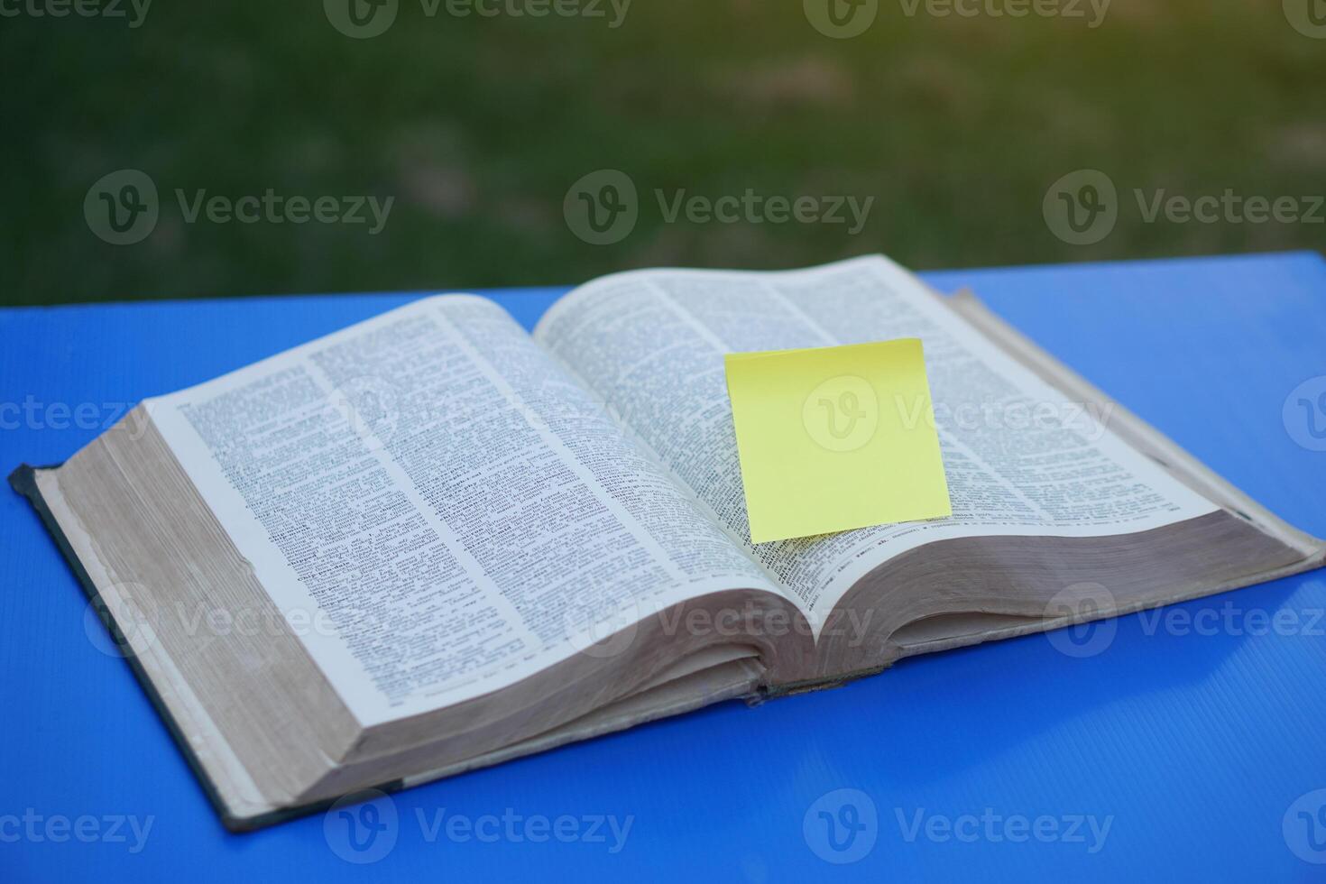 Opened page, dictionary, book with blank yellow paper for adding text or word. Concept, education. photo