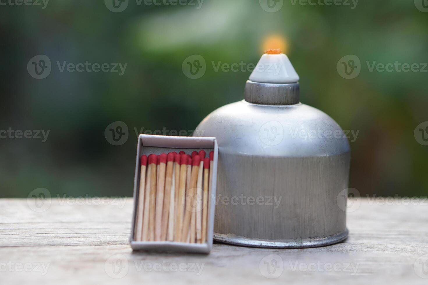 Stainless steel alcohol burner lantern. Laboratory lamp and box of matches. Concept, equipment or tool for science experiment. Educational toolkit in science subject. photo