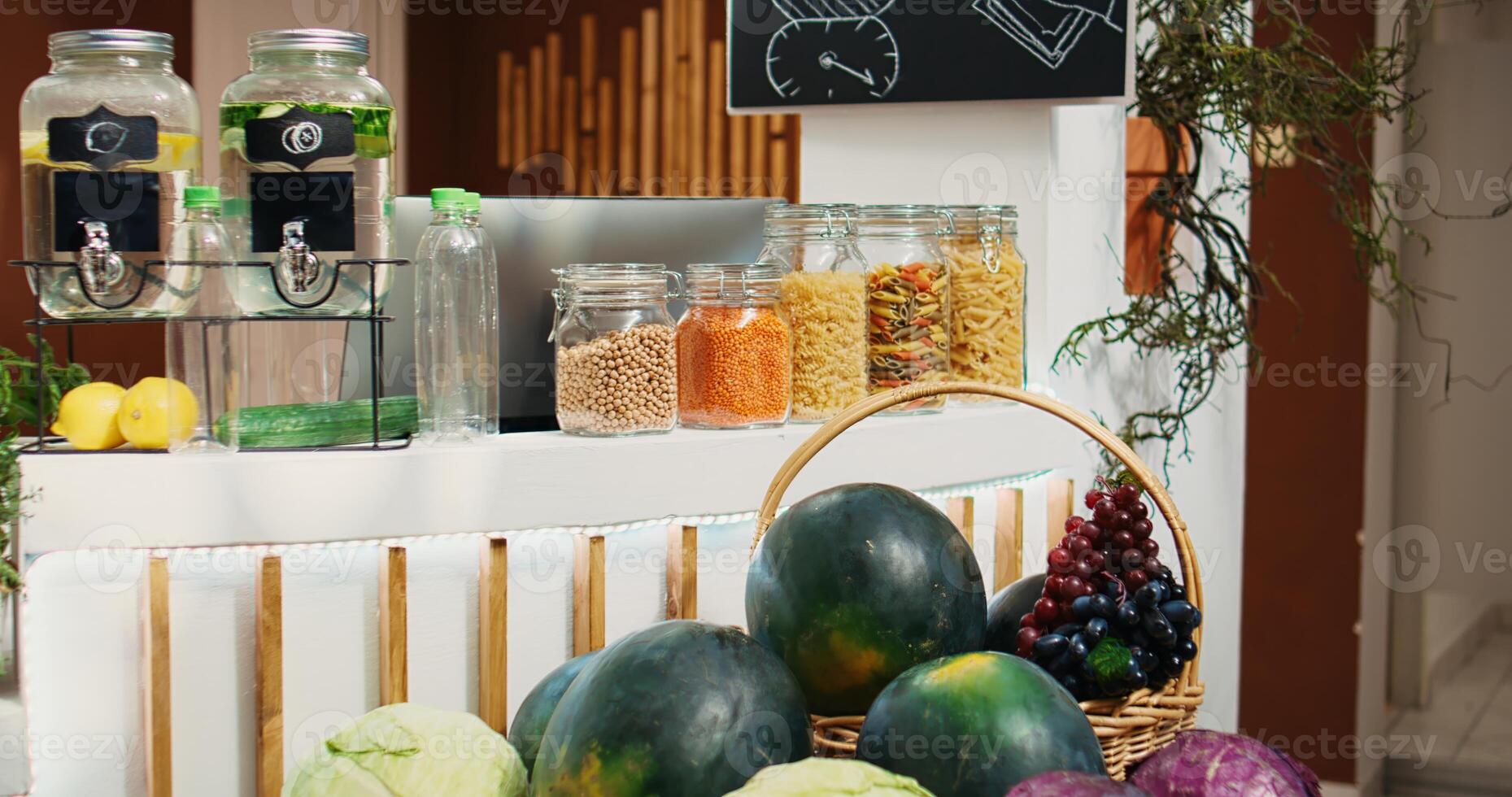 Chemicals free pantry staples and vegetables in eco friendly zero waste supermarket. Organic food in decomposable reusable glass jars in empty local neighborhood grocery store, zoom out shot photo