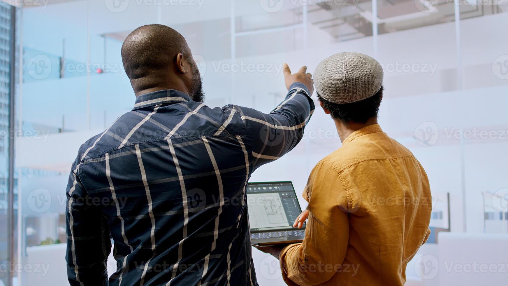 Real estate team and businesswoman discussing workspace design and planning, reviewing layout blueprints during an office tour. Investing in property leasing for startup development. Camera A. photo