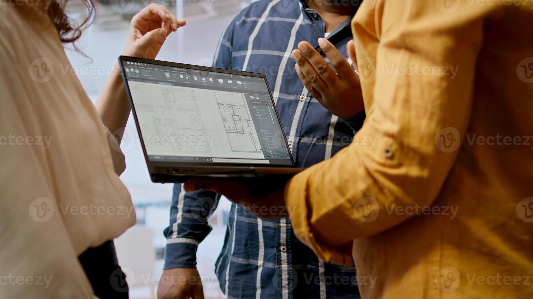 Real estate agent advising clients on office relocation and leasing, reviewing detailed blueprints and discussing the architectural design of the new property. Contract negotiation. Camera A. photo