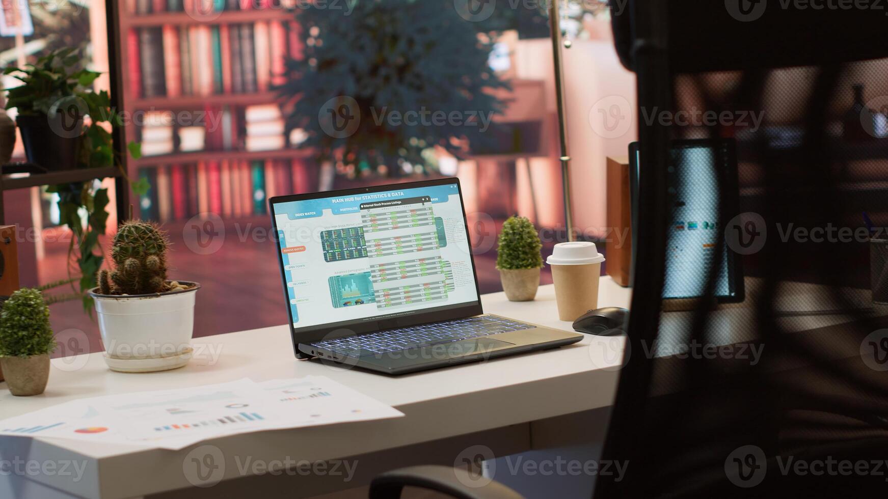 Empty home setup belonging to an entrepreneur with data sales analytics and financial reports on laptop, accountancy information and invoices for remote work. Finance and economy. photo