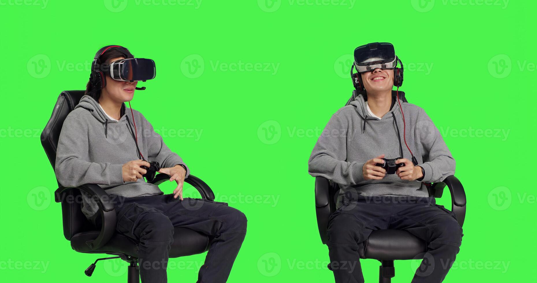 Asian player having fun with electronics while playing games with vr headgear and controller. Young man seated against greenscreen background, enjoying online action adventure. photo