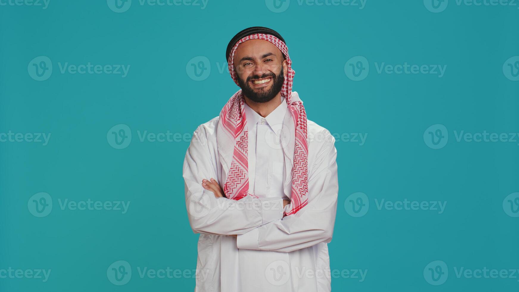 In the studio, islamic person says yes and nods, indicating support and acceptance for things. Middle eastern guy expressing his opinion in studio, showcasing optimism and positivity. photo
