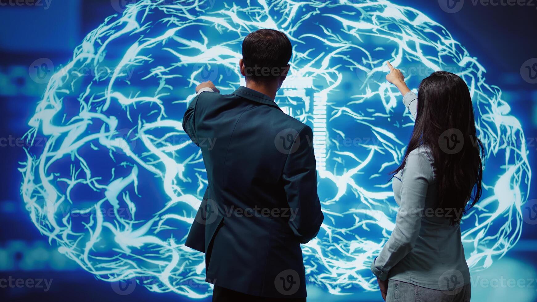 IT staff members using artificial intelligence computing simulating human brain thought processes. Coworkers building AI machine learning algorithms in futuristic workspace, camera B photo